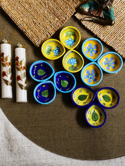The Heritage Diya Collection: Jaipur Blue Pottery Diyas (Set of 12) & Aromatic Puducherry Candles (Set of 2) - Botanical Radiance