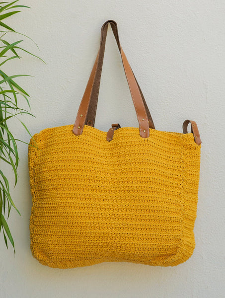 Yellow crochet cotton bag with Scandinavian-style slit selling handles