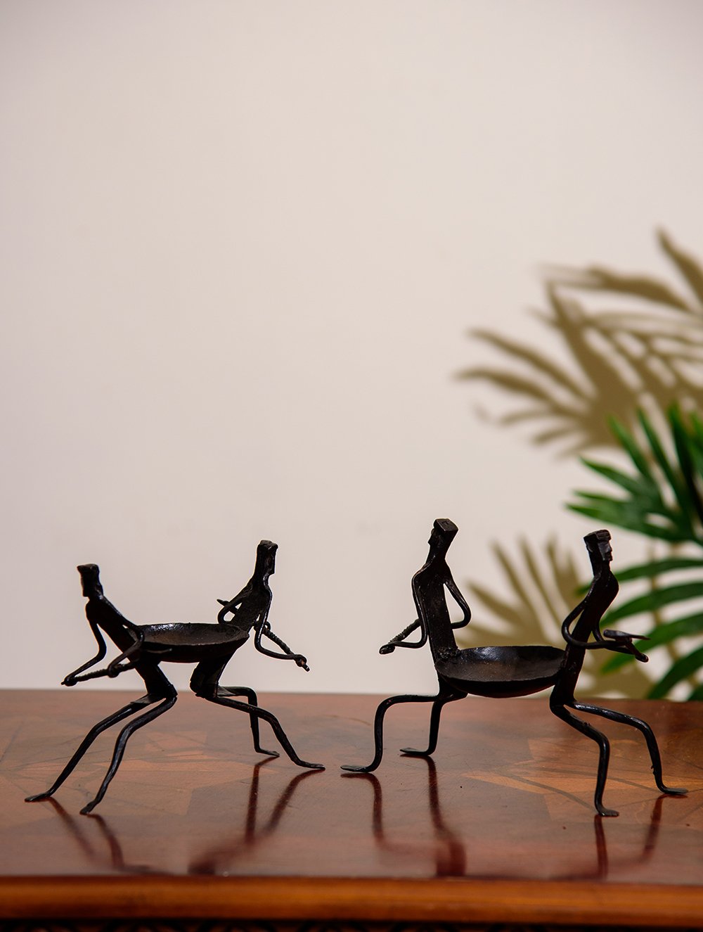 The India Craft House Bastar Tribal Men Couple Candle Holders (Set of 2)