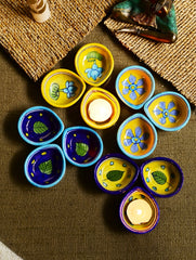 The Heritage Diya Collection: Jaipur Blue Pottery Diyas (Set of 12) & Aromatic Puducherry Candles (Set of 2) - Botanical Radiance