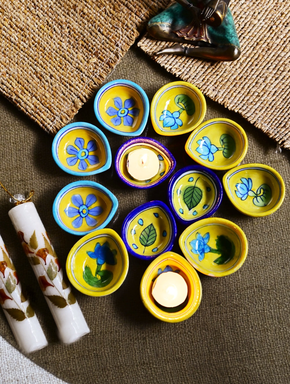 The Heritage Diya Collection: Jaipur Blue Pottery Diyas (Set of 12) & Aromatic Puducherry Candles (Set of 2) - Festive Flora