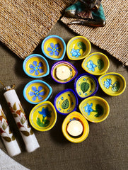 The Heritage Diya Collection: Jaipur Blue Pottery Diyas (Set of 12) & Aromatic Puducherry Candles (Set of 2) - Festive Flora