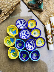 The Heritage Diya Collection: Jaipur Blue Pottery Diyas (Set of 12) & Aromatic Puducherry Candles (Set of 2) - Royal Garden.